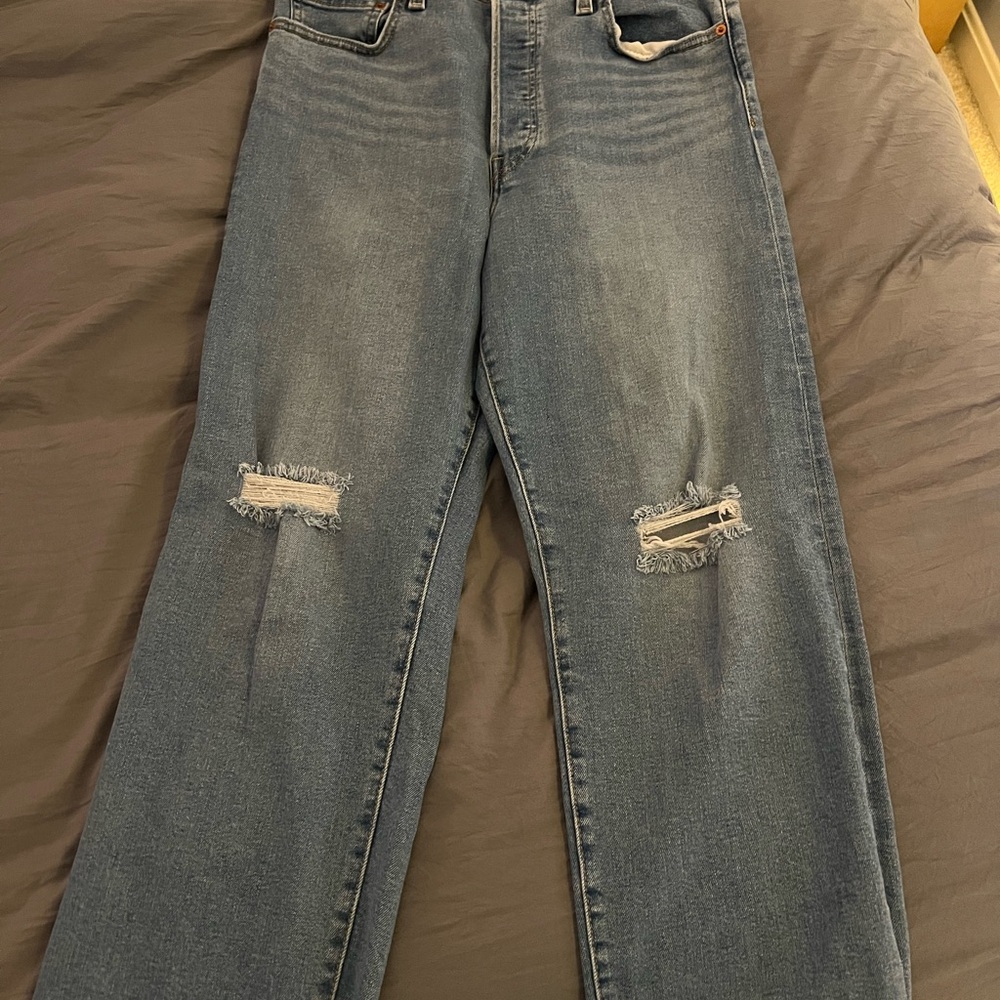 Women’s Blue Distressed Jeans: Levi’s